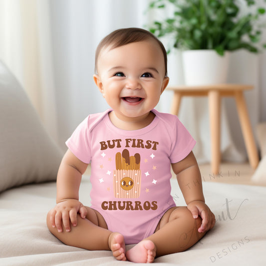 BUT FIRST CHURROS BABY BODYSUIT PINK