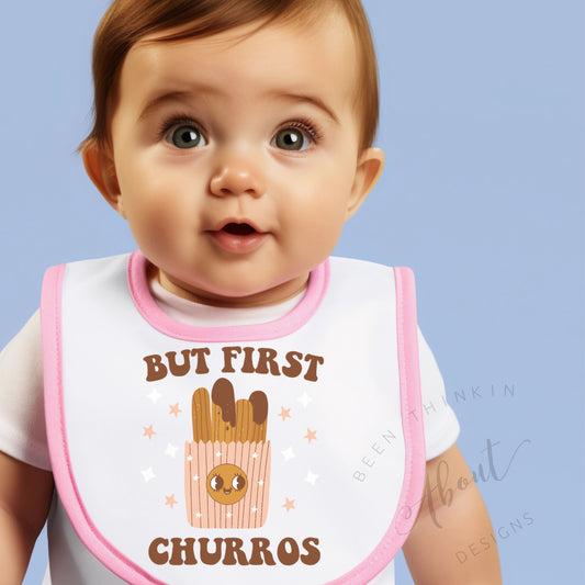 BUT FIRST CHURROS BABY BIB WITH PINK OR BLACK TRIM